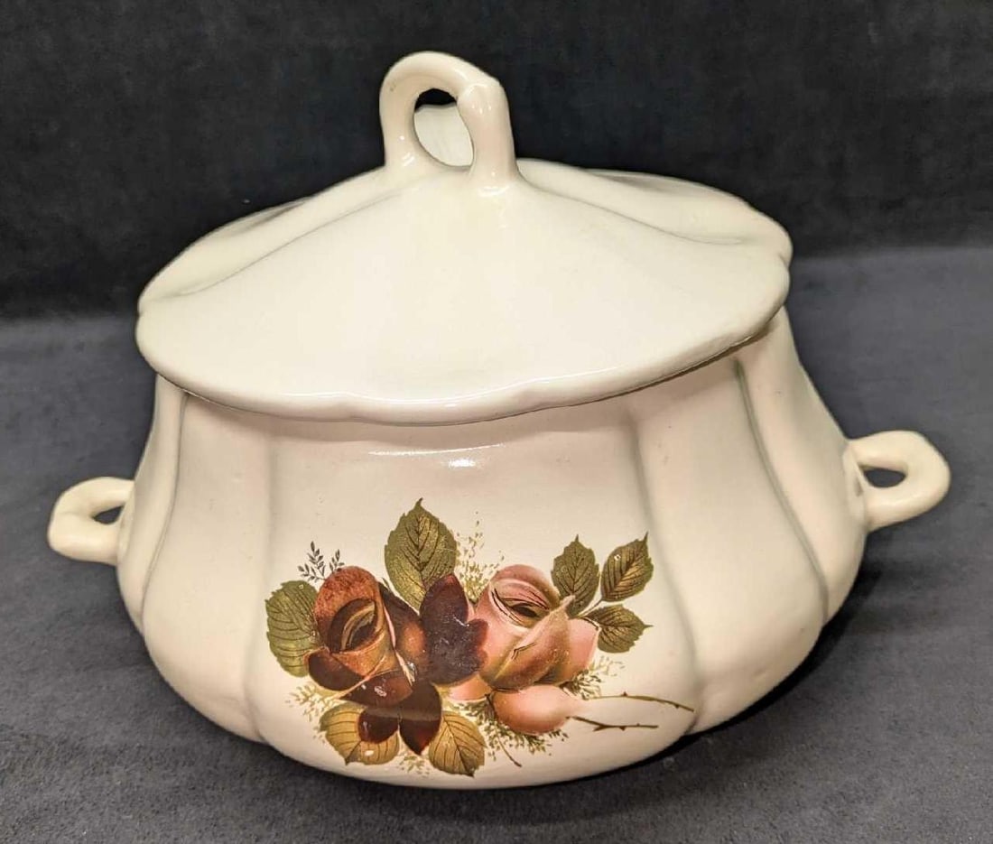Vintage Ceramic Floral Pattern Serving Tureen With Spoon: Vintage Ceramic Floral Pattern Serving Tureen With Spoon. The maker and date of creation is unknown. This is approx 12" x 9" x 8 1/2" and it weighs 3.55lbs. There are some markings on the tureen.
