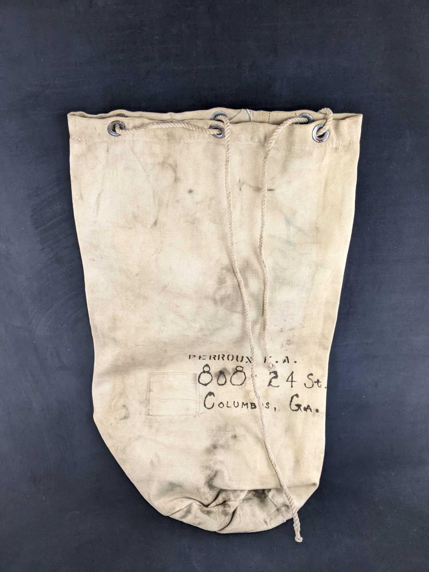 Vintage Military Belongings Sack: Vintage Military Belongings Sack This is a sack that seems to be a belongings sack that identifies the person by address. This is in used condition but has no damage such as holes. Approx 32in