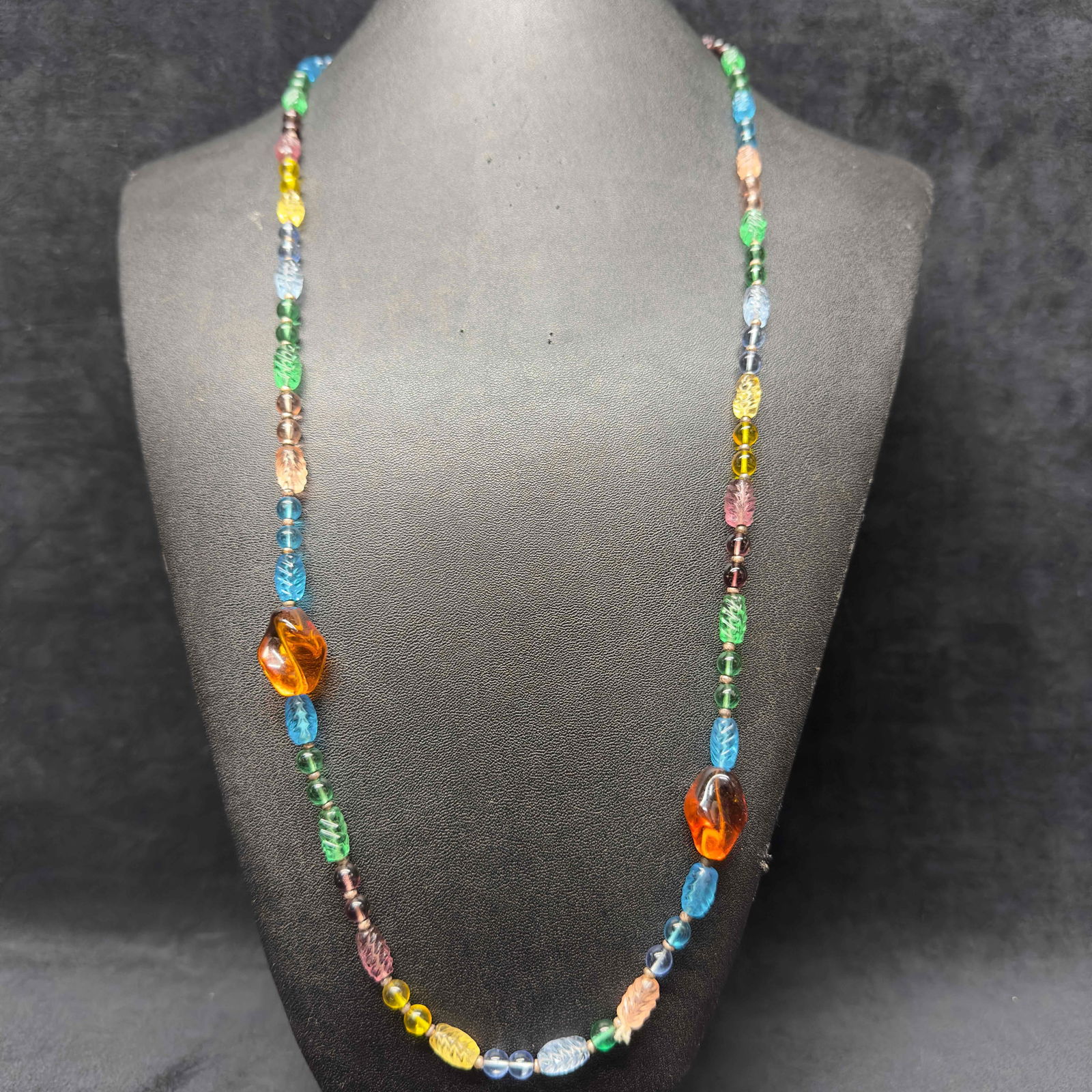Murano Venetian Lamp Work Art Glass Light Multi Color Beaded Necklace G17: Murano Venetian Lamp Work Art Glass Light Multi Color Beaded Necklace G17. Necklace with light multi colored glass beads with beautiful designs on each. The necklace features several shaped beaded