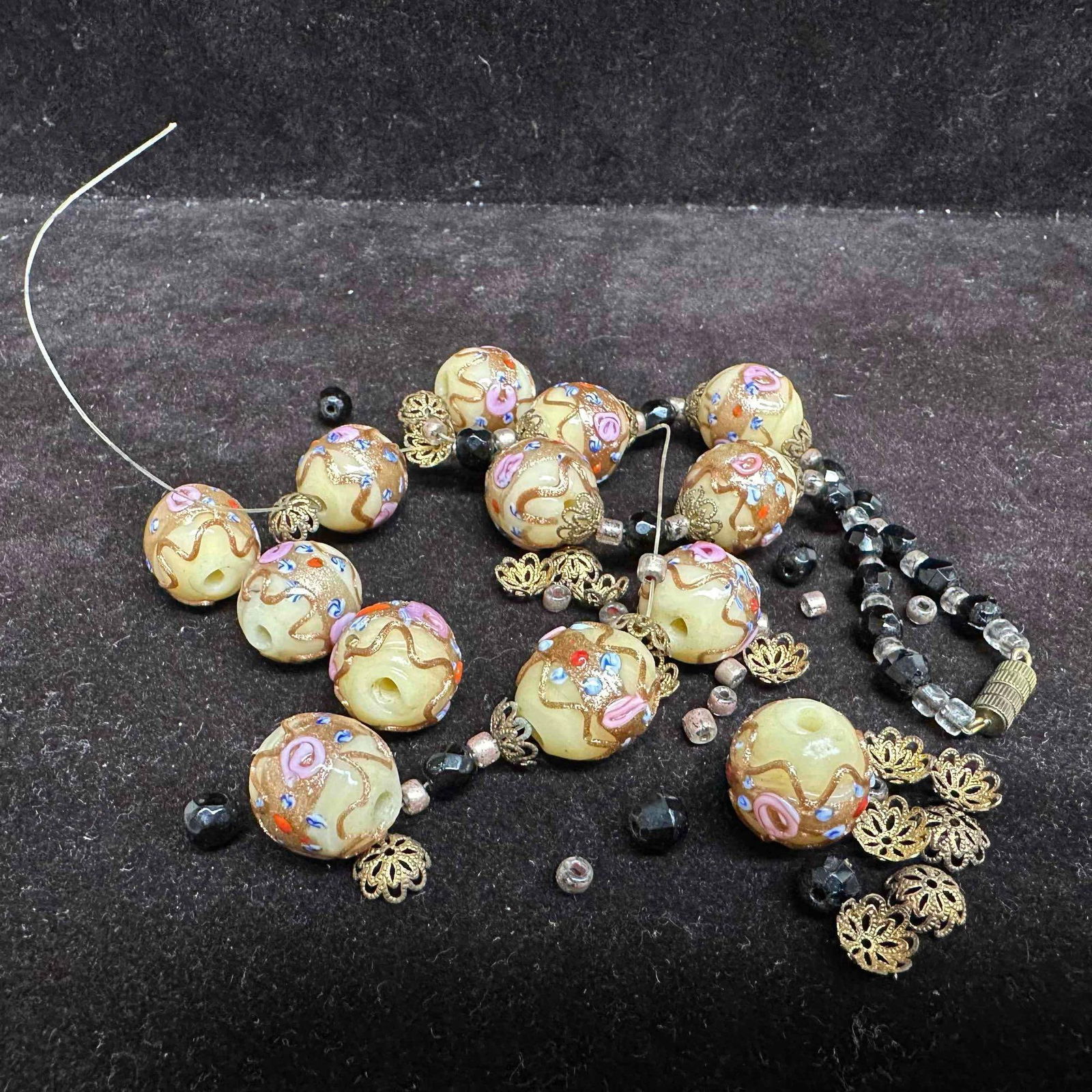 Murano Venetian Lamp Work Glass Fiorato Cream Round Bead Black Beaded Necklace A31 Broken: Necklace with cream colored glass beads with beautiful hand painted floral designs on each. The necklace features black colored beaded accents. The necklace features a barrel clasp. The necklace has