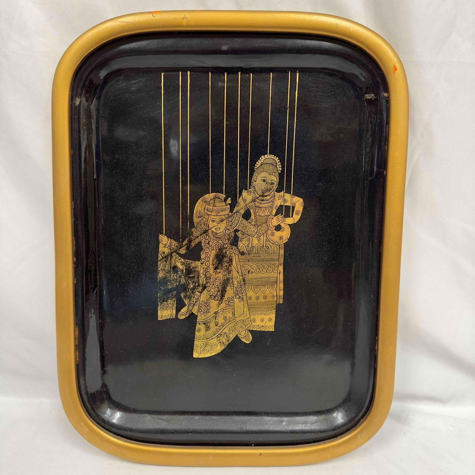 Toleware Serving Tray Framed Gold Black Lacquer Puppet Marionettes: This toleware tray features two puppet marionettes on a black lacquer gold trim frame. Unknown artist with no distinctive markings. This item is in good pre-owned, previously displayed condition with