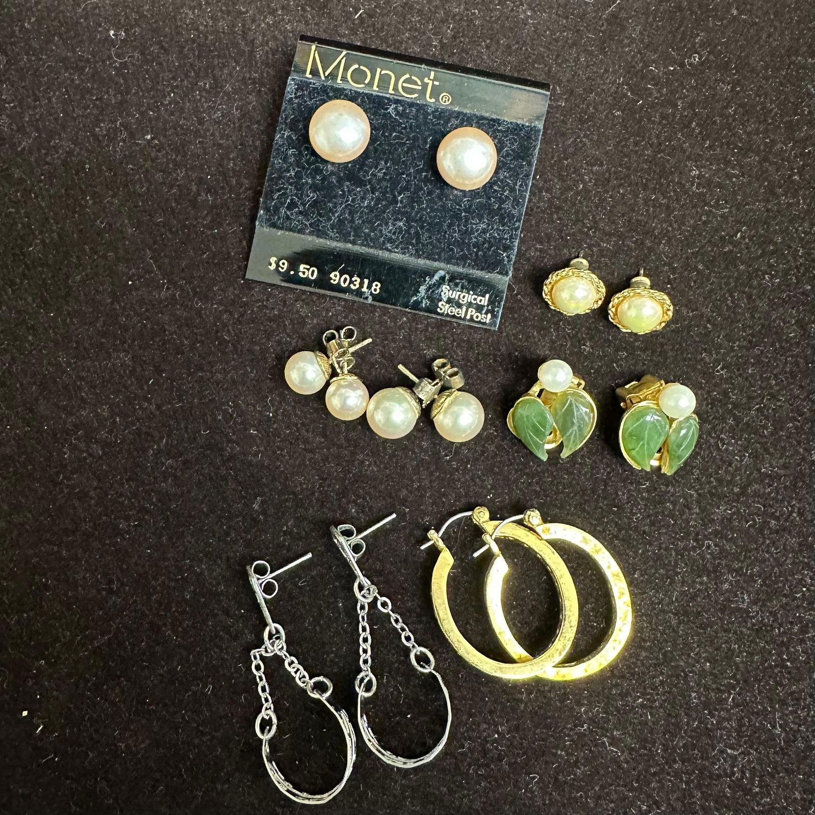 Vintage Costume Jewelry Earring Lot Mixed Styles and Materials: An assortment of vintage and modern costume jewelry earrings featuring a wide variety of designs. Seven pairs included. These items are in pre-owned, previously displayed condition with light wear