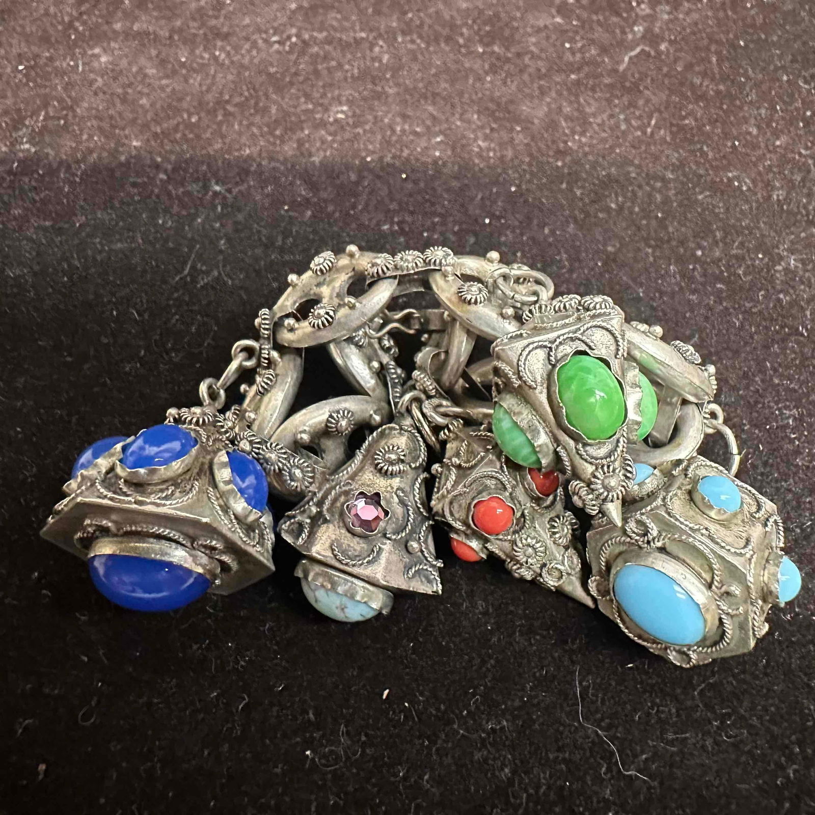 Etruscan Revival Style Silver 800 Multiple Ornate Gemstone Charms Bracelet H10: This item is in good pre-owned, previously used/displayed condition with noticeable light wear, and surface scratches. Please reference all photos for full details. This piece of jewelry has been