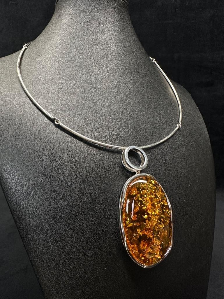 Sterling Necklace with Huge Amber Cabochon : This piece of jewelry has been tested and researched prior to listing. Please view all our pictures they are part of our description. DETAILS: Metal - 925 Sterling SilverColor - SilverStones -