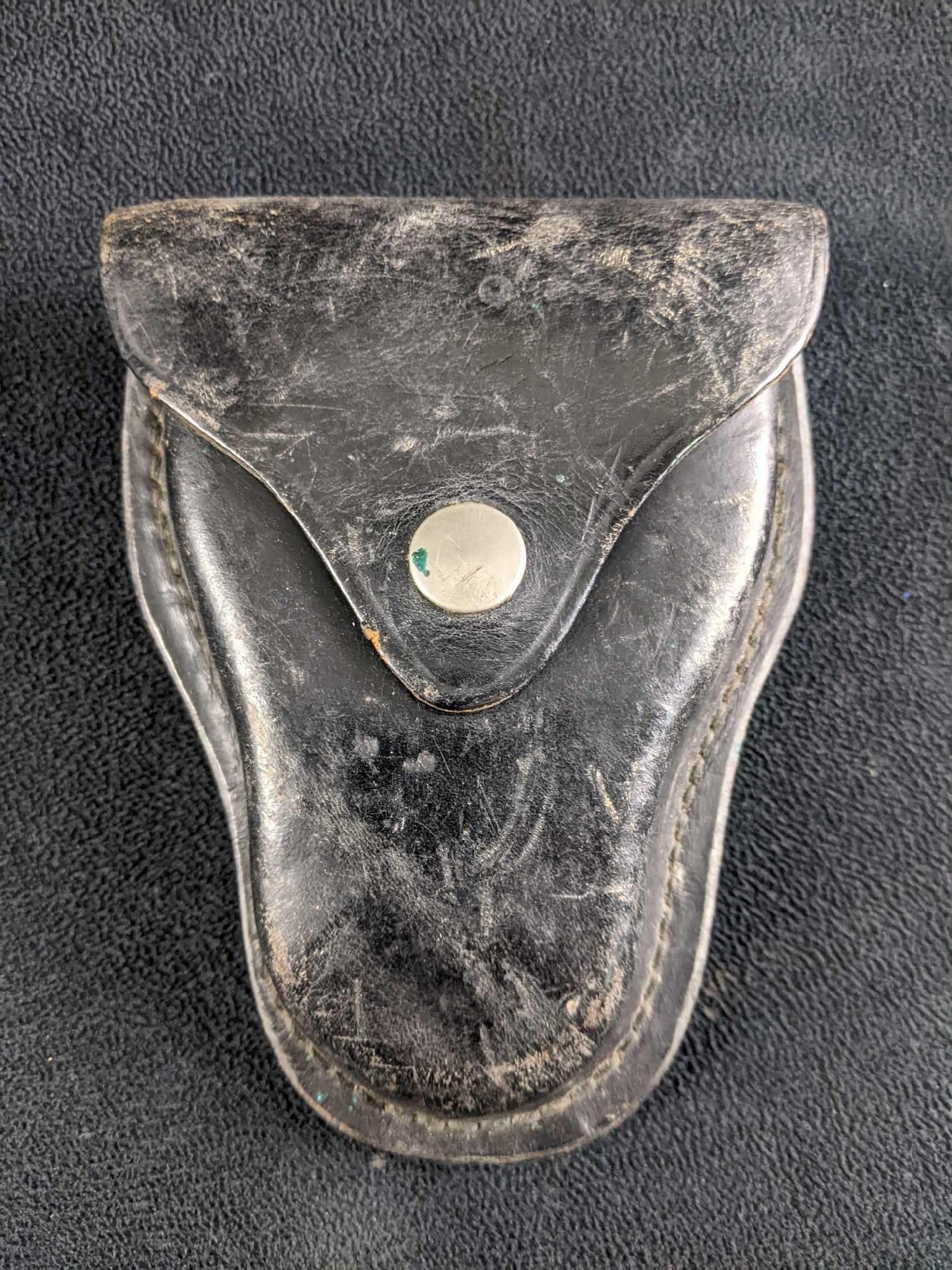 Black Leather Handcuff Case Bucheimer: Black Leather Handcuff Case Bucheimer This is a vintage authentic leather handcuff case used on a police belt. This case is made by Bucheimer. This holster has some scratches and wear but no