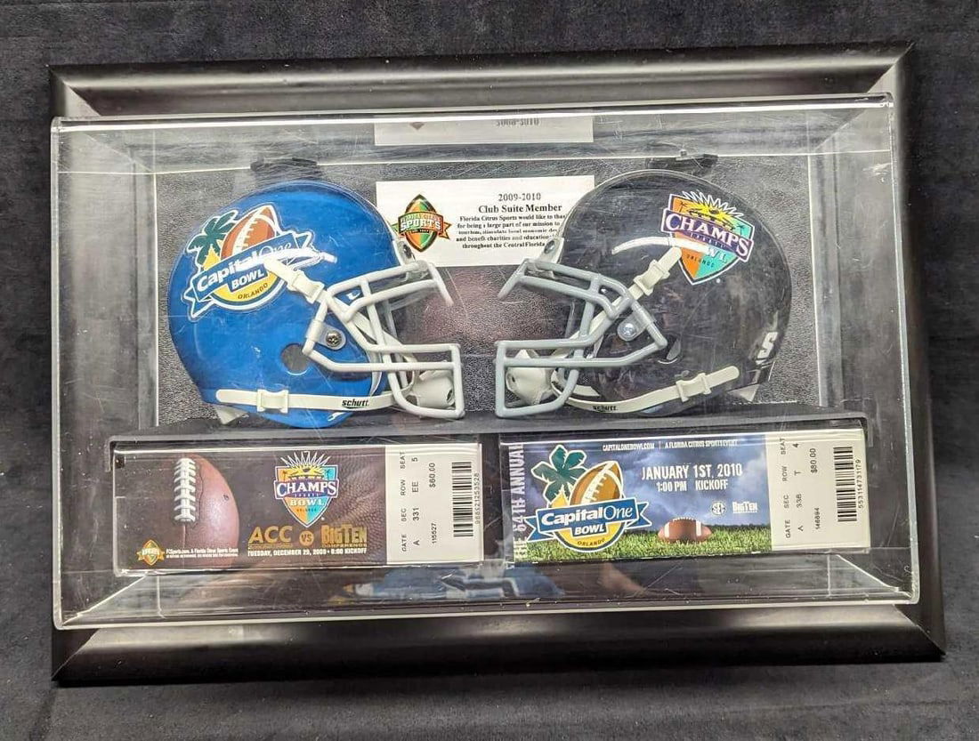 College Football Capital One And Champs Bowl Display: College Football Capital One And Champs Bowl Display. The clear acrylic shadowbox comes with mini football helmets and tickets. This is approx 20" x 6" x 14" and it weighs 6lbs. Please note, that the