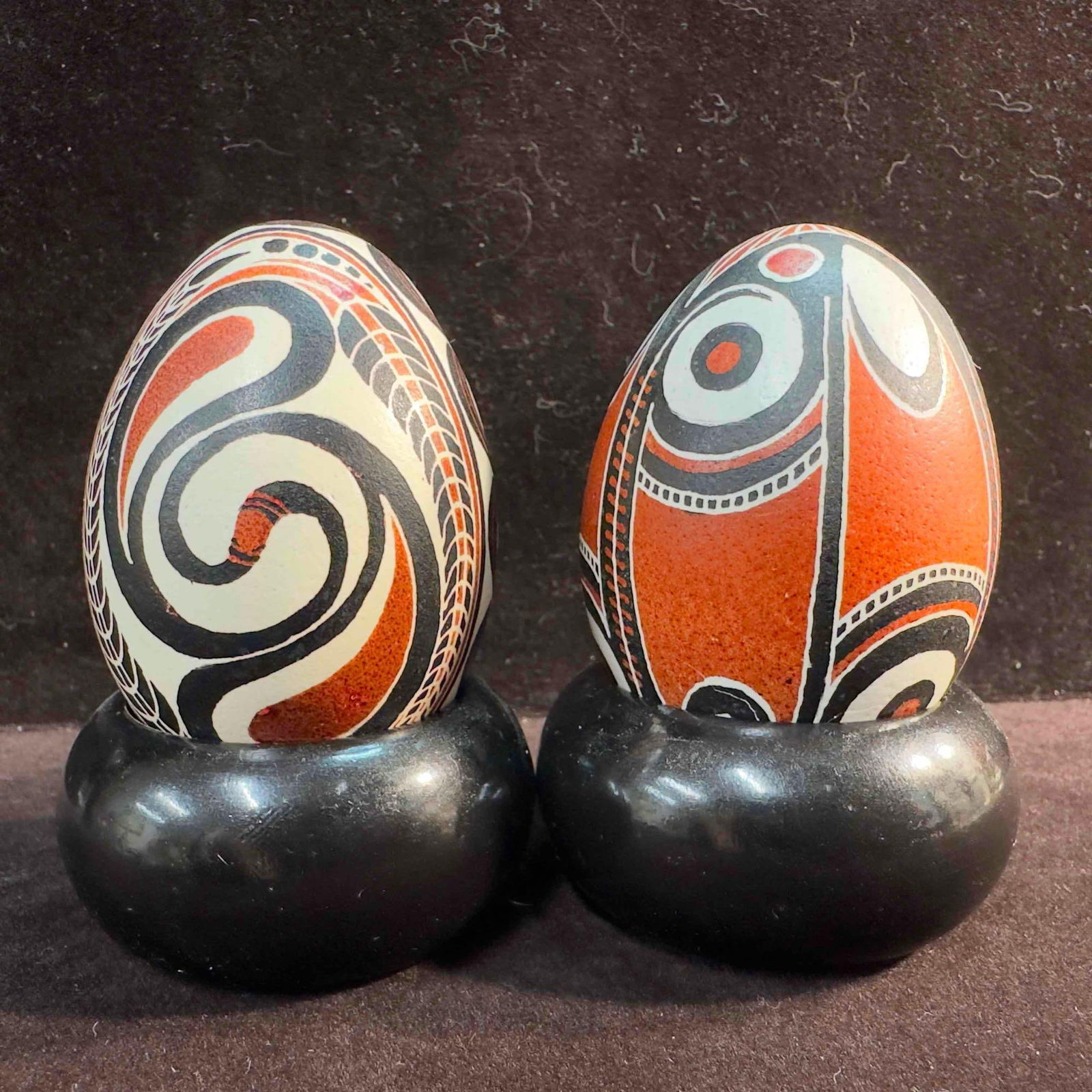 India Hand Painted Kashmir Faberge Decorative Eggs Set : Made in India Hand Painted Kashmir Faberge Decorative Eggs Set. this set features a white, black, and brown design on each egg. Both eggs come with a round wooden base holder. One egg has small