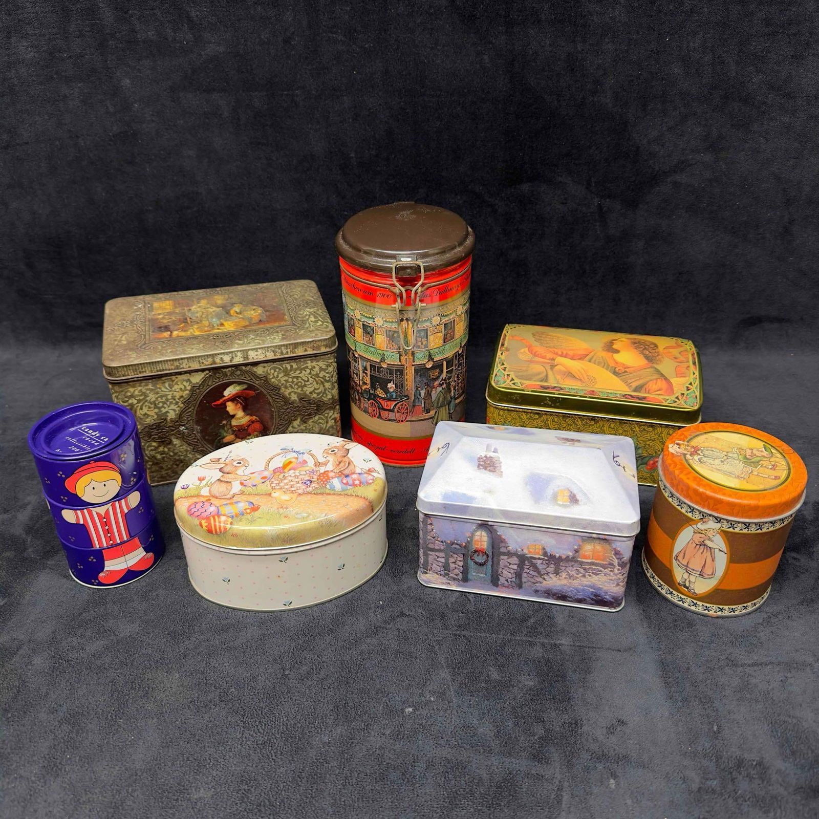 Collection of Vintage Collectible Tin Containers Dallmayr Coffee Thomas Kinkade Set of Seven 7: Collection of Vintage Collectible Tin Containers Dallmayr Coffee Thomas Kinkade Set of Seven 7. Each collectible tin is unique with some being older vintage. One tin is a Easter theme while one is a