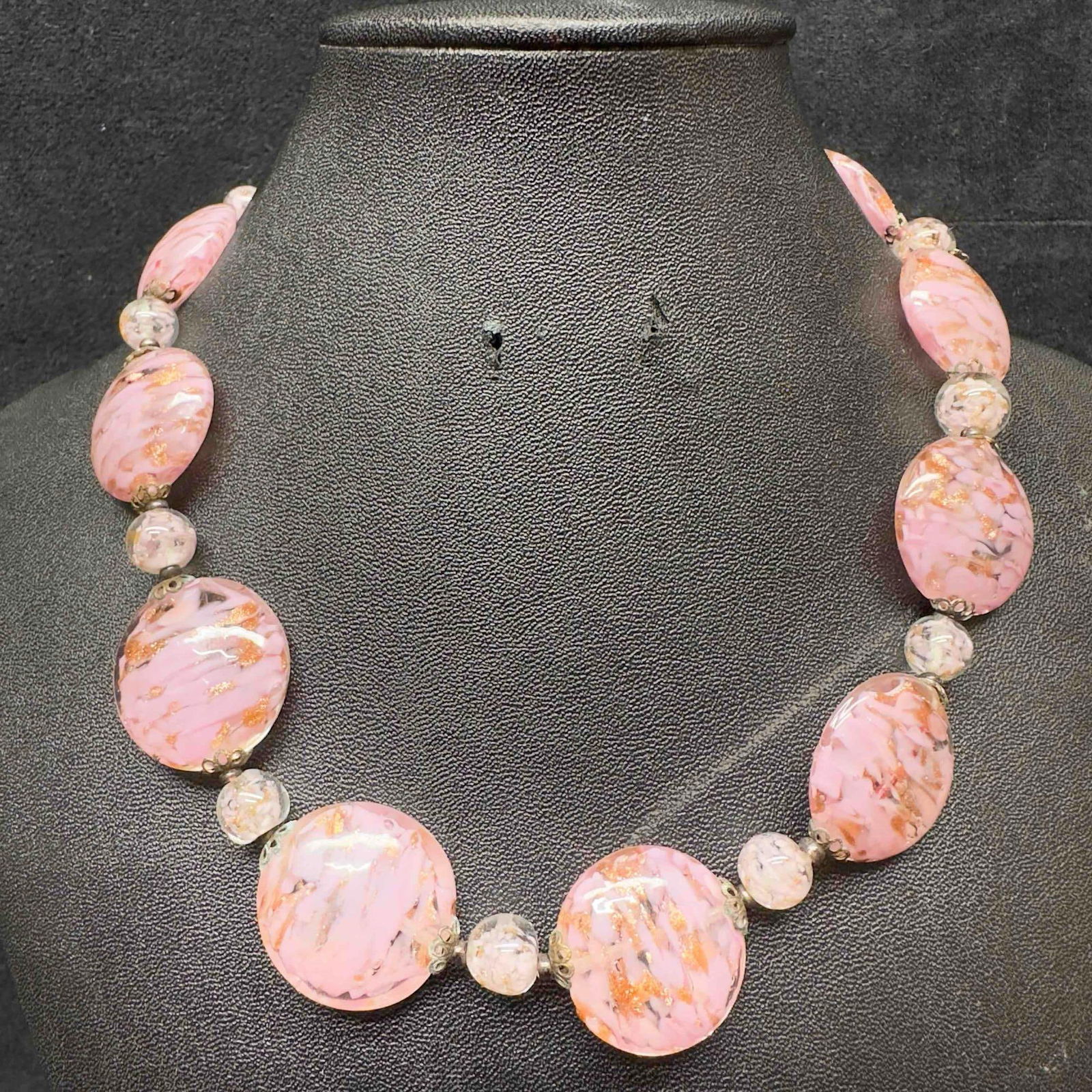Venetian Murano Lamp Work Art Glass Pink Copper Circle Beaded Necklace C40: Venetian Murano Lamp Work Art Glass Pink Copper Circle Beaded Necklace C40. Necklace with pink colored glass beads with beautiful designs on each. The necklace features copper colored accents. The nec