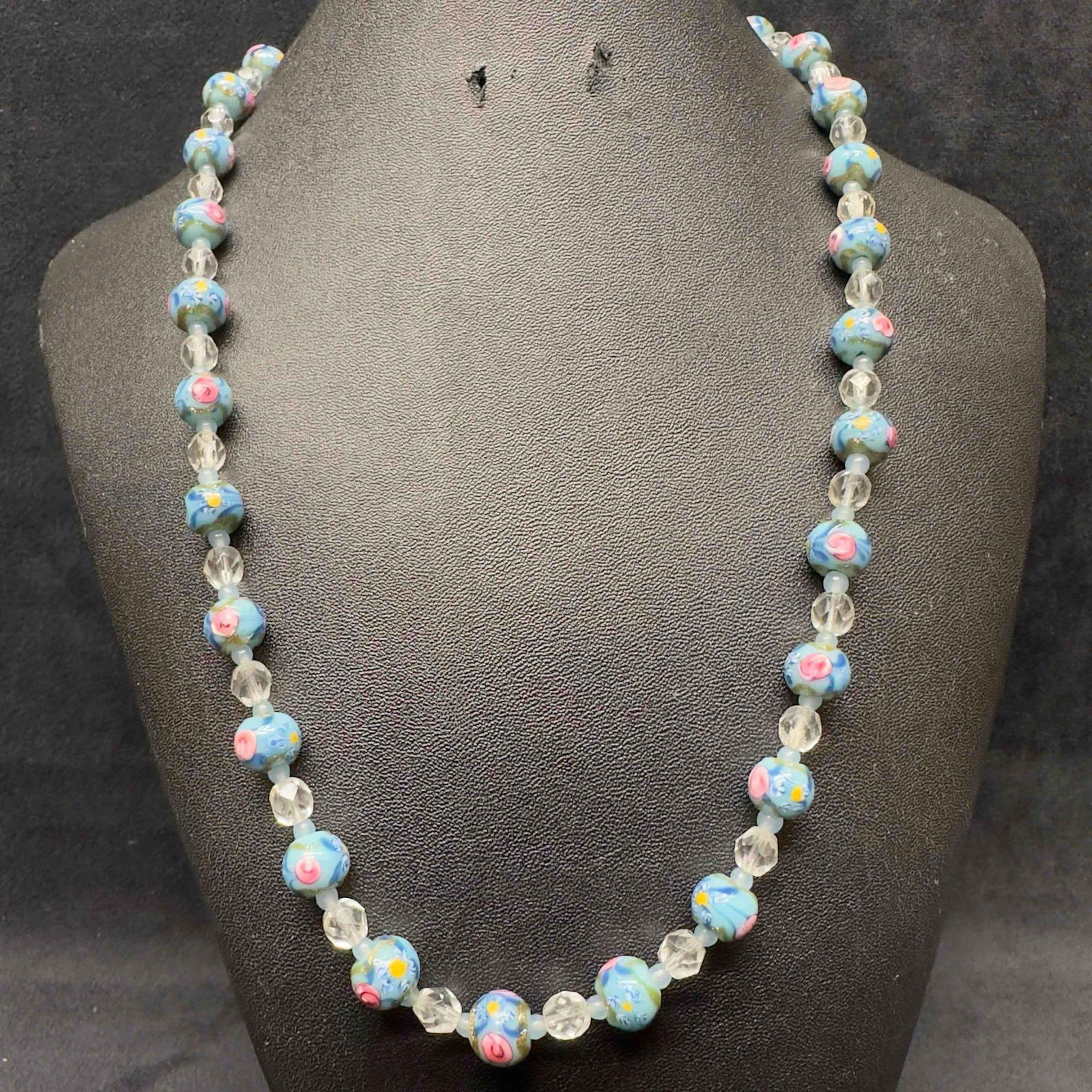 Murano Venetian Lamp Work Art Glass Light Blue Round Pink Floral Beaded Necklace F46: Murano Venetian Lamp Work Art Glass Light Blue Round Pink Floral Beaded Necklace F46. Necklace with light blue colored glass beads with a beautiful design on each. The necklace features pink and