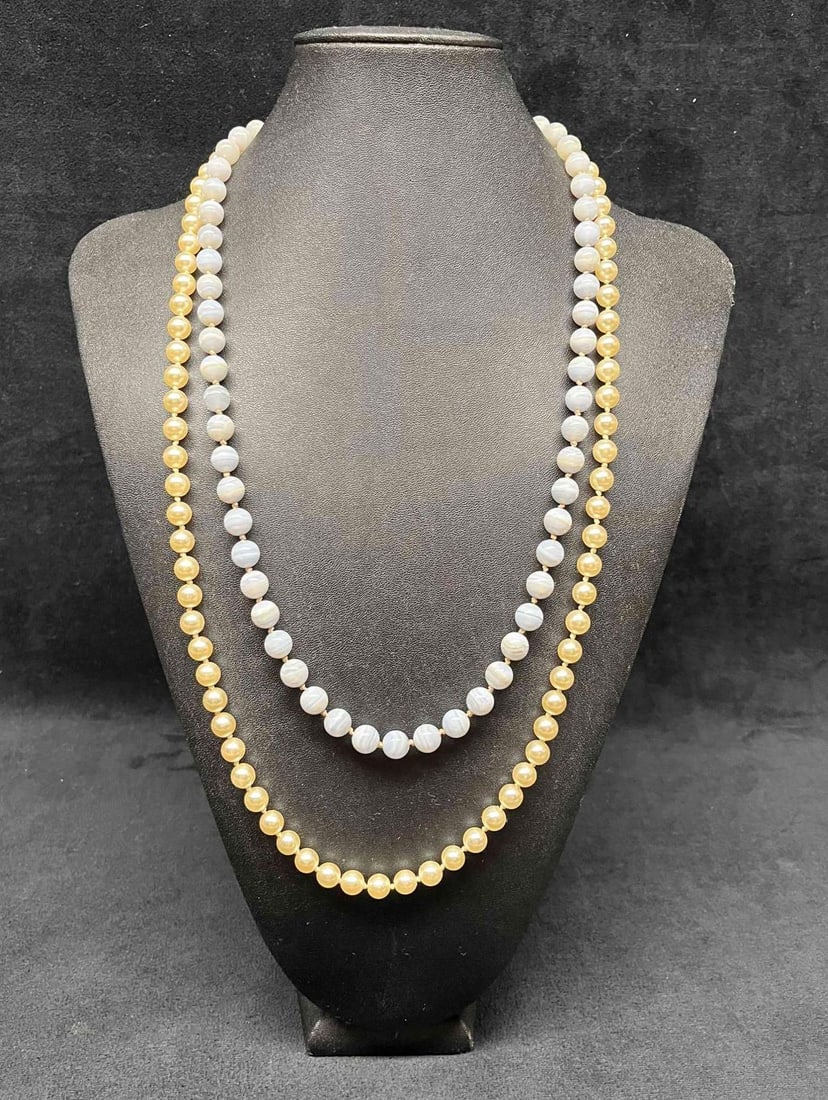 Necklaces Faux Pearls & Light Purple Onyx Like Stone: This lot contains two Necklaces Faux Pearls & Light Purple Onyx Like Stone. Each necklace is one size fits all with an adjustable clasp and together they weigh about 0.2lbs. Overall the necklaces 