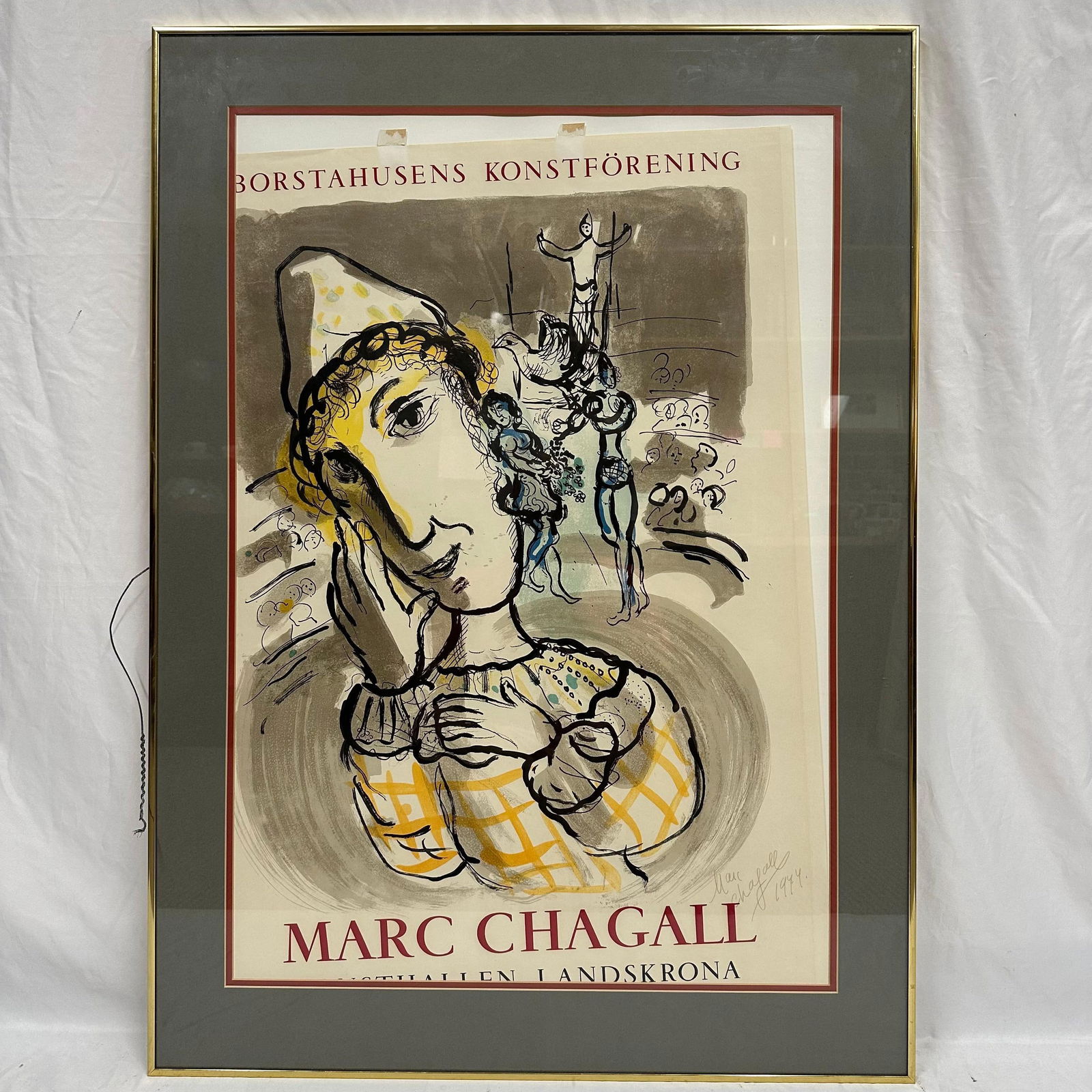 Marc Chagall Yellow Circus Clown Signed Poster Gold Metal Frame: Vintage exhibition poster for Marc Chagall (1887–1985), created for Borstahusens Konstforening in Landskrona, Sweden. This striking lithograph-style poster features Chagall’s signature com