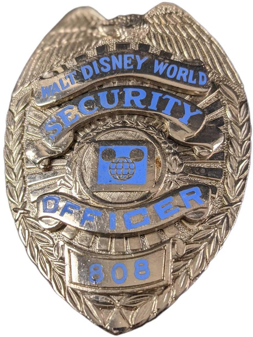 1970s/1980s Disney World Security Metal Badge: 1970s/1980s Disney World Security Metal Badge. Is approx 2 1/4" x 3/4" x 3" and it weighs under one pound at 0.16lb. The metal badge is in a good, vintage condition with some wear, paint loss and