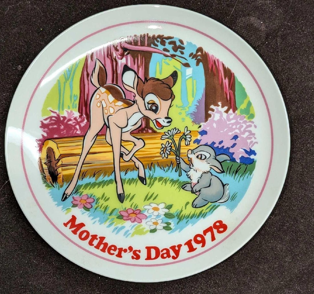 Schmid Disney Mother's Day 1978 Bambi Plate: Schmid Disney Mother's Day 1978 Bambi Plate. The ceramic plate has a hook on the back for easy hanging. This is approx 7 5/8" x 7 5/8" x 3/4" and it weighs 0.71lb. The plate has no chips or cracks.