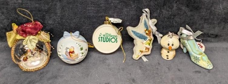 6 Disney Frozen Pooh Mickey Mouse Tinkerbell Ornaments: 6 Disney Frozen Pooh Mickey Mouse Tinkerbell Ornaments. This lot includes: (1) Hallmark - Itty Bittys Oraf Ornament. This is approx 2" x 2" x 3 1/2". (1) Disney Hollywood Studios - Osborn