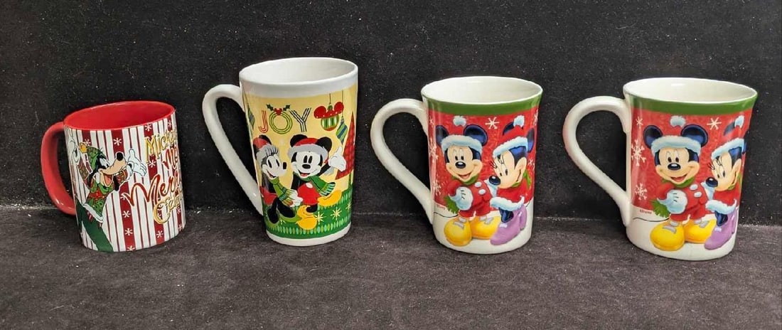 4 Disney Mickey Mouse Christmas Holiday Mugs: 4 Disney Mickey Mouse Christmas Holiday Mugs. This lot includes: (2) Kcare Christmas Mickey And Minnie Mouse Mug. This is approx 4 1/2" x 5" x 3 1/2".(1) Joy Christmas Mickey And Minnie