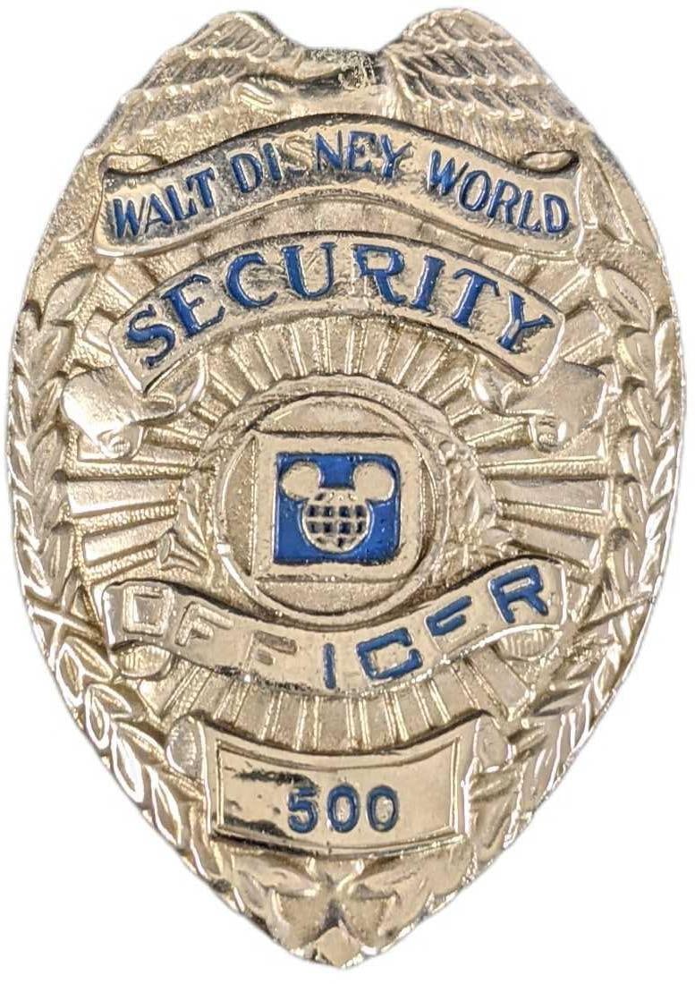 Early 1980s Disney World Security Metal Badge: Early 1980s Disney World Security Metal Badge. Is approx 2 1/4" x 3/4" x 3" and it weighs under one pound at 0.13lb. The metal badge is in a good, vintage condition with some wear and mini scratches