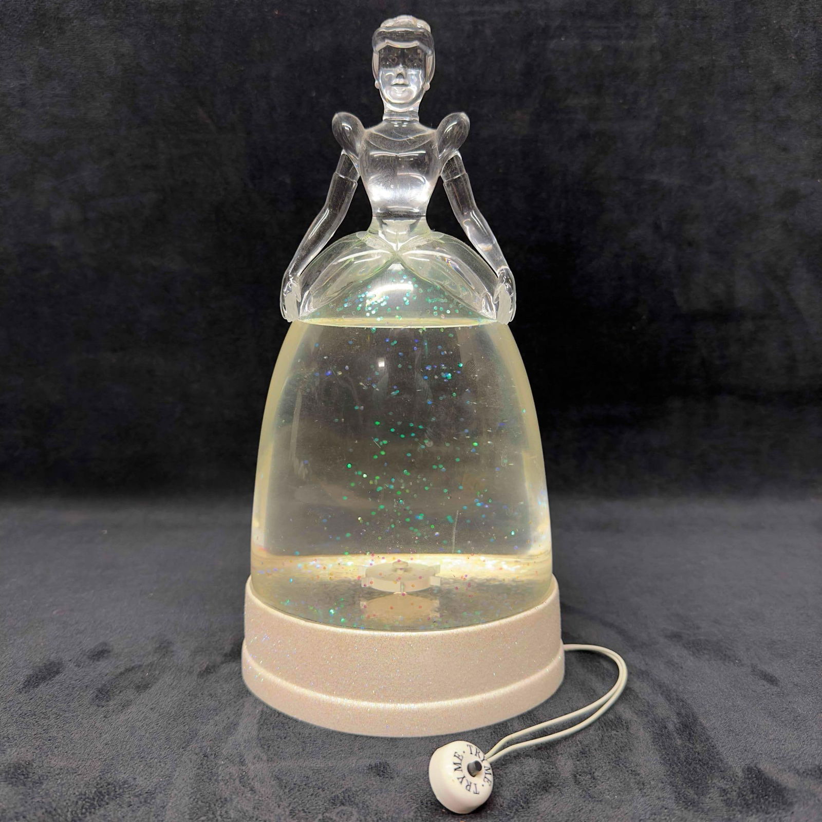 Disney Cinderella Kcare Light Up Snow Globe: Disney Cinderella Kcare Light Up Snow Globe. This Disney Kcare plastic snow globe features Cinderella. Glitter and blue light features. Blower and light-up are fully functional. The item is in great