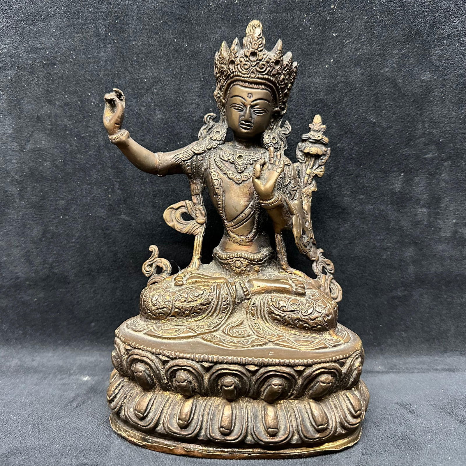 Cast Metal Bronze Buddhist Deity Figure Seated Form: This item is in good pre-owned, previously displayed condition with light wear and surface markings. Please reference all photos for full details. Sculpture: 9" tall x 6 1/4" x 3 1/2".