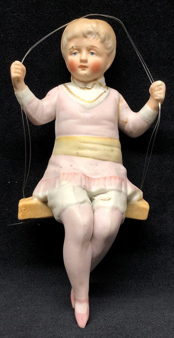 Antique Porcelain Bisque Girl on Swing - Made in Germany: Antique Porcelain Bisque Girl on Swing. Made in Germany. The item measures approximately 6-1/2" x 2" x 3-1/4" and it weighs about 0.2lbs. Overall the Porcelain Bisque Figurine is in poor, used