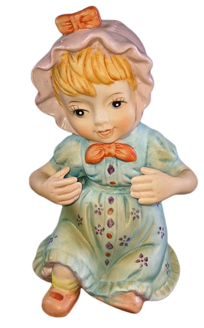 Vintage Ceramic Baby Girl Figurine: Vintage Ceramic Baby Girl Figurine. The maker and date of creation are unknown. The figurine is approx 4" x 4" x 7" and it weighs under one pound at 0.75lb. The figurine is in a good, vintage