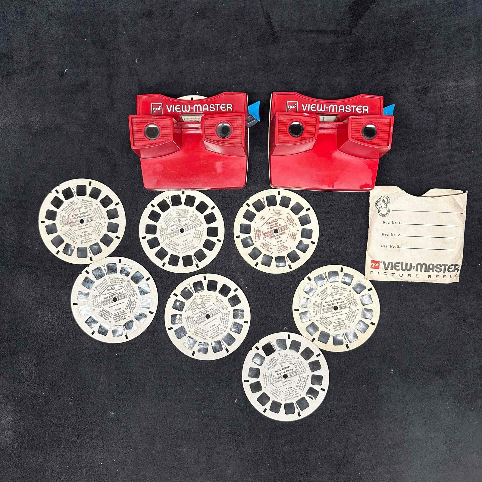 GAF View-Master Viewer and Picture Reels Set: Two view master viewers and eight reels. These items are in good pre-owned, previously displayed condition with light wear, and surface scratches. Please reference all photos for full details. View-M