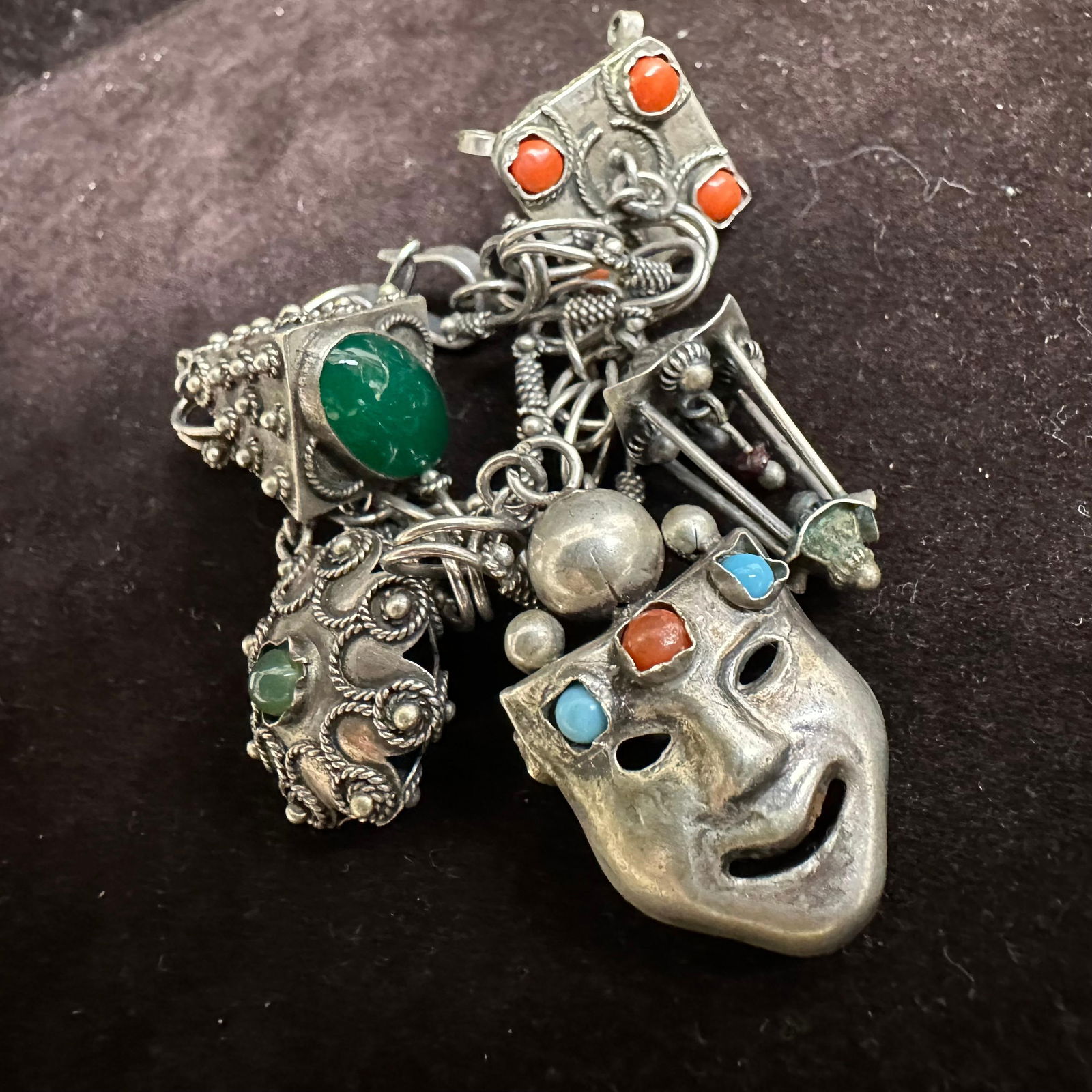 Vintage 800 Silver Charm Colored Stones Bracelet Mask and Ornate Charms: This item is in good pre-owned, previously used/displayed condition with noticeable light wear and surface scratches. Please reference all photos for full details. This piece of jewelry has been teste