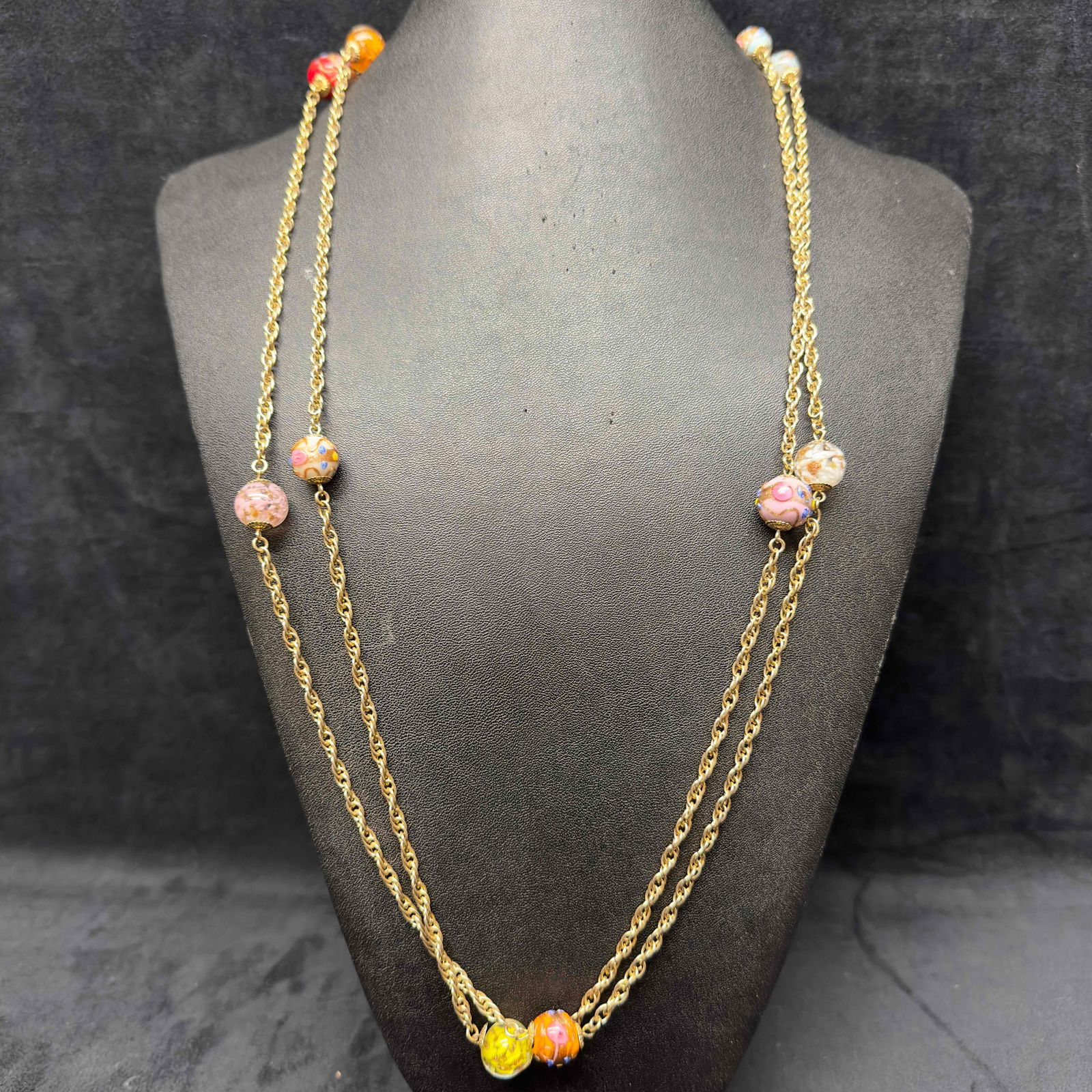 Murano Venetian Glass Lamp Work Round Multi Colored Copper Bead Fiorato Beaded Chain Necklace A63: Murano Venetian Glass Lamp Work Round Multi Colored Copper Bead Fiorato Beaded Chain Necklace A63. Necklace with multi colored glass beads with beautiful hand painted designs on some. The necklace