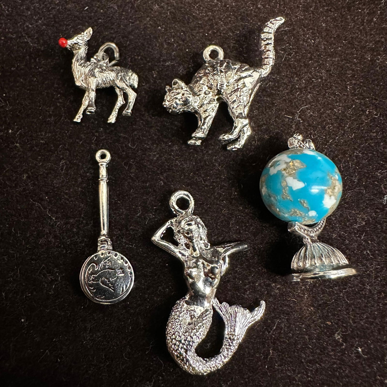 Silver Tone Bracelet Necklace Costume Jewelry Charm Set Cat Reindeer Mermaid Globe: A group of five silver tone Bracelet and/or Necklace Costume Jewelry Charm Set featuring a cat, a reindeer, a mermaid, a globe, and a bird motif object. These items are in good pre-owned, previously d