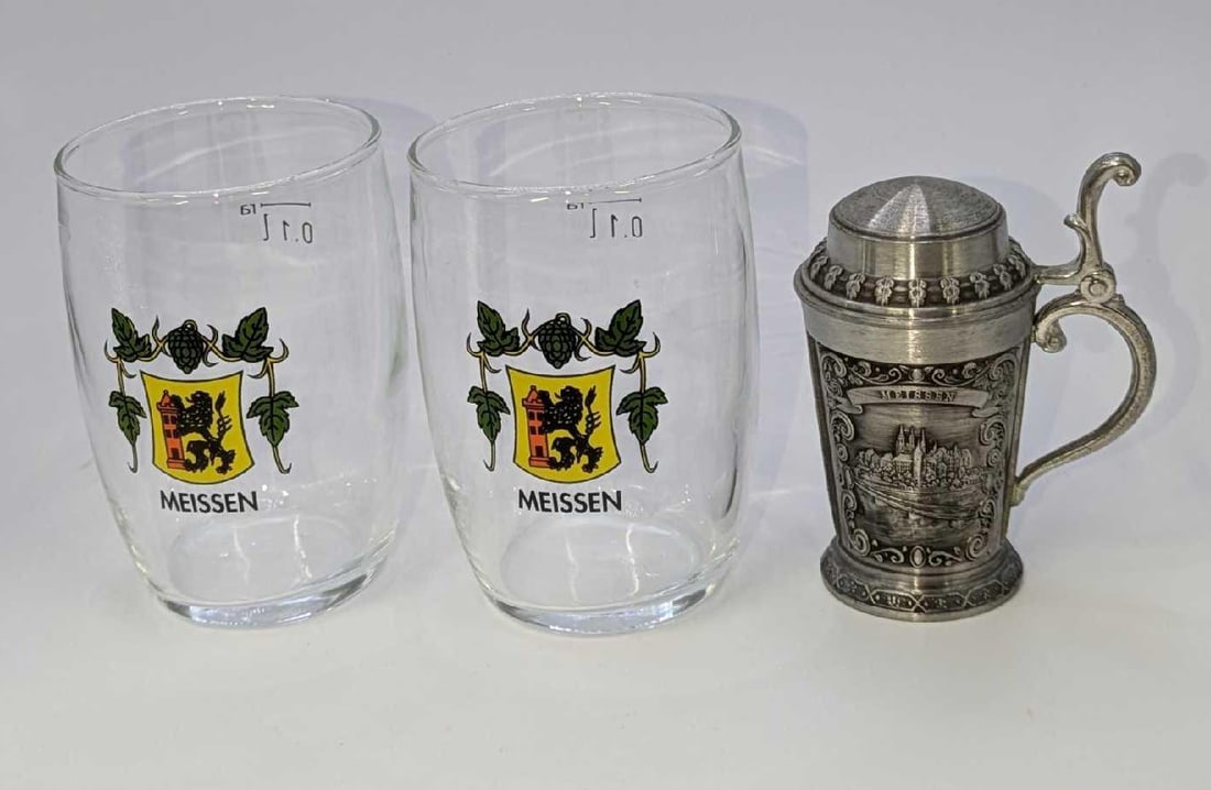 German Mini Meissen Glasses And Pewter Shot Glass: German Mini Meissen Glasses And Pewter Shot Glass. This lot includes: (2) German Meissen Glasses 0.1l/100 mL glasses. Each is approx 2 1/2" x 2 1/2" x 3 1/4". (1) Vintage German Dresden P