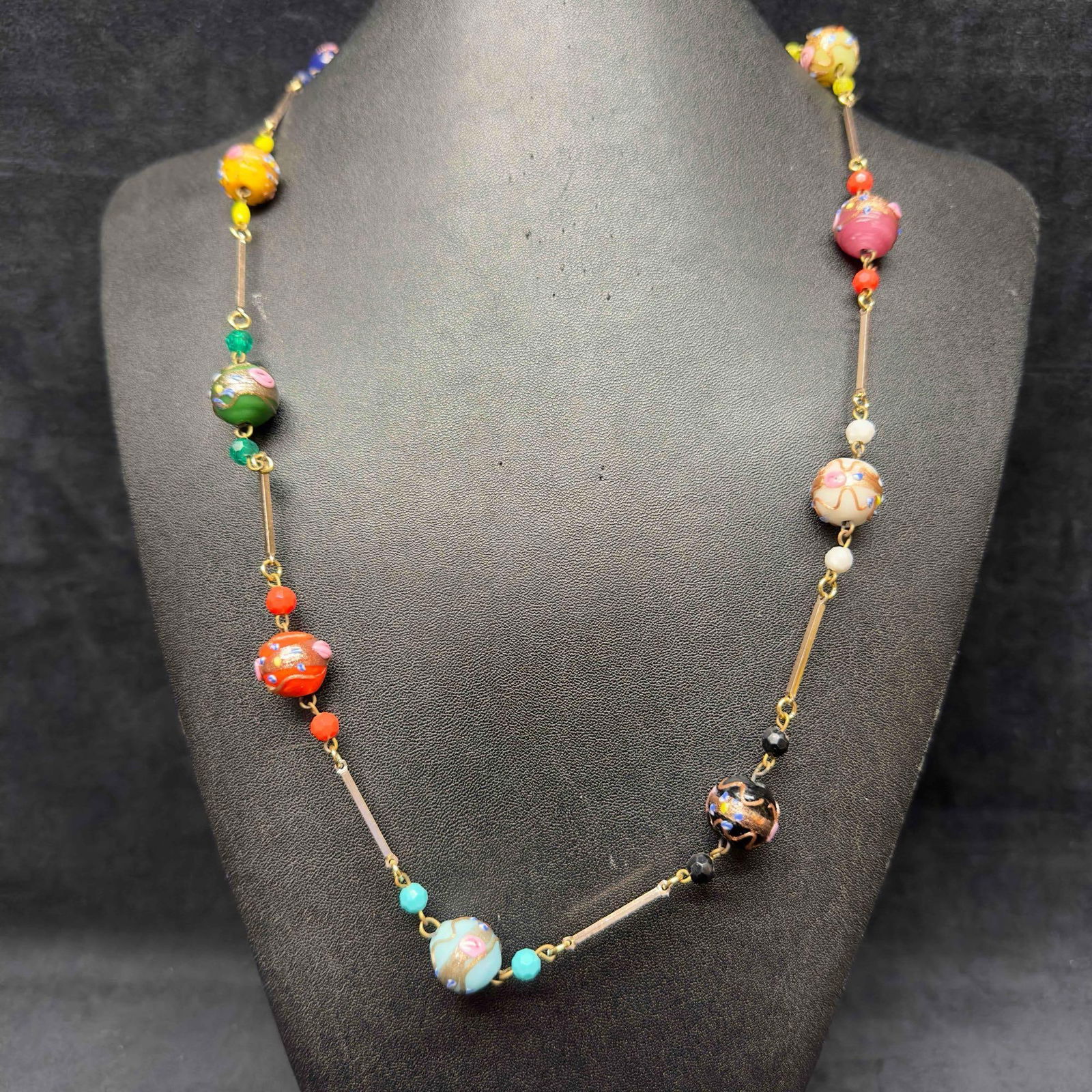 Murano Venetian Art Glass Lamp Work Bead Multi Colored Beaded Chain Necklace C7: Murano Venetian Art Glass Lamp Work Bead Multi Colored Beaded Chain Necklace C7. Necklace with multi colored glass beads with beautiful hand painted designs on each. The necklace features copper