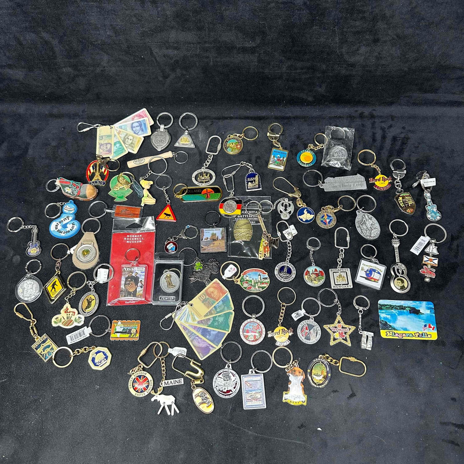 Large Lot of Vintage and Souvenir Keychains Travel Tourist Novelty Hard Rock Key Chain Set: Collection of over 25+ vintage and souvenir key chains from around the world. Includes tourist destinations such as Niagara Falls, Yellowstone, Paris, Budapest, Maine, Vermont, Nova Scotia,