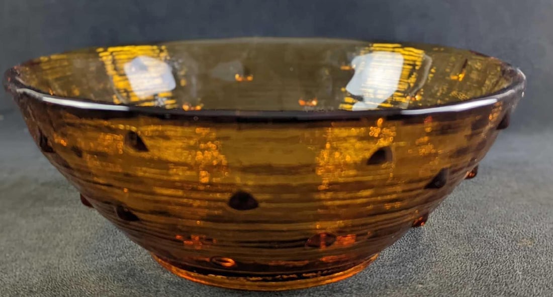 Vintage Heavy Amber Glass Bowl: Vintage Heavy Amber Glass Bowl. The maker and date of creation are unknown. The bowl is approx 10 1/2" x 10 1/2" x 4" and it weighs 5lbs. The bowl is in a good, used condition with no chips or
