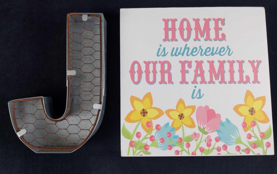 Home Is Whereever And Metal J Signs: This lot consists of: (1) Light wood "Home Is Wherever Our Family Is" Sign. This is approx 10" x 1" x10". The sign is in good, used condition with some wear and a chip on the top