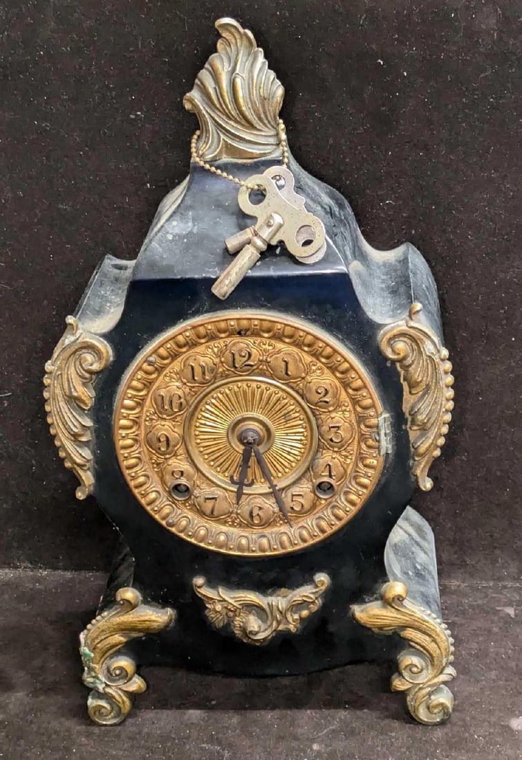 Antique American Ansonia Iron Clock: Antique American Ansonia Iron Clock. Untested. This is approx 7 3/4" x 4 1/2" x 13 3/4" and it weighs 10lbs. The clock has some signs of wear, markings, candle residue and chips. Please see the