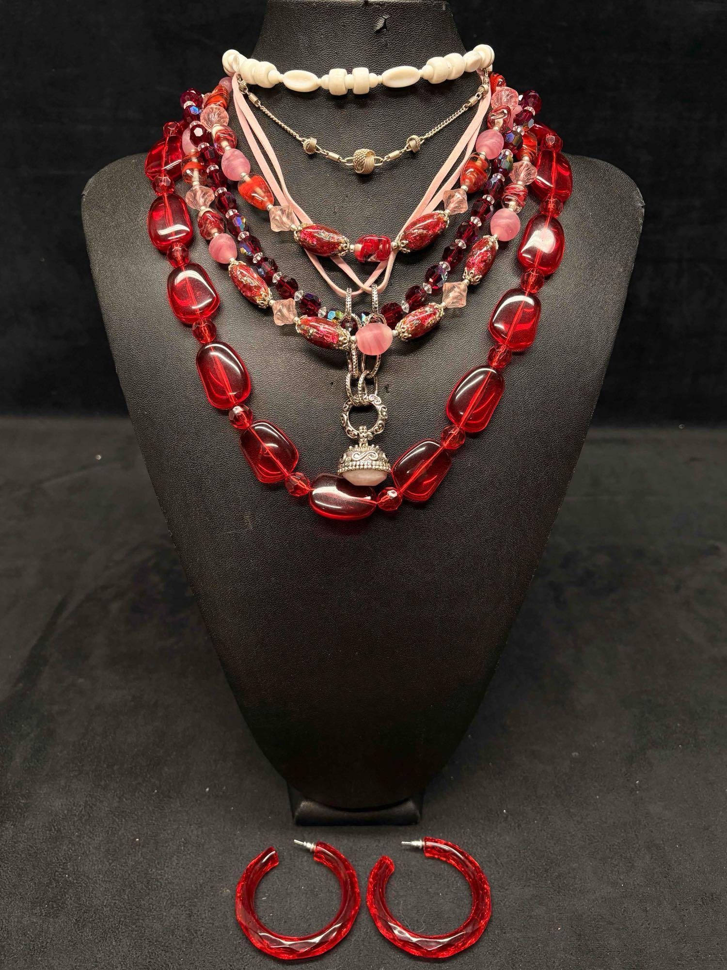 7pc Red Pink and Silver Lover Girl Necklace Lot: This lot consists of 7 pre-owned costume jewelry necklaces with typical wear from use. Please review images for context of the lots visual conditions. APPROX. WEIGHT: 9.8 OZ