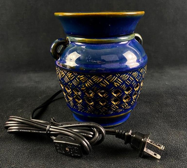 Blue Ceramic Wax Warmer: Blue Ceramic Wax Warmer PartyLite brand ceramic wax warmer lamp in blue glaze. Uses an incandescent bulb to heat up scented wax and give off a pleasant smell. Approximate size: 5.5" x