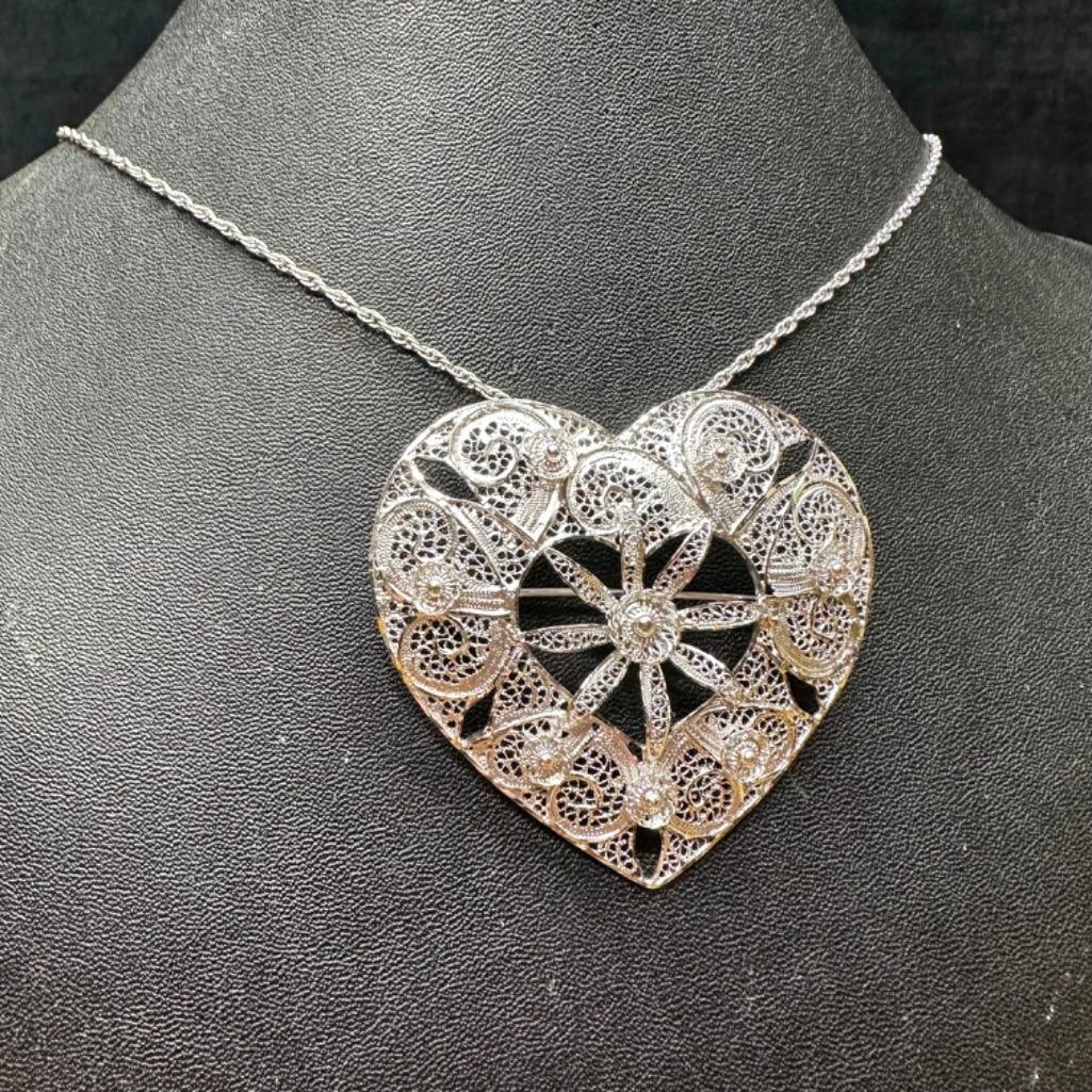 Sterling Filigree Heart Pendant/Brooch Necklace: This piece of jewelry has been tested and researched prior to listing. Please view all our pictures they are part of our description. DETAILS: Metal - Sterling Silver Color - Silver Stones - none Hal