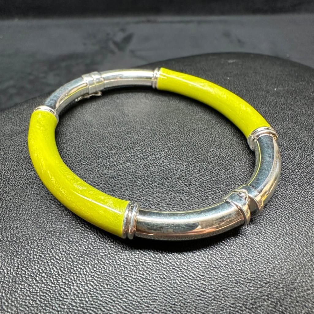 Milor Sterling Yellow Resin Hinged Bracelet: This piece of jewelry has been tested and researched prior to listing. Please view all our pictures they are part of our description. DETAILS: Metal - Sterling Silver Color - Silver Stones - none Hal