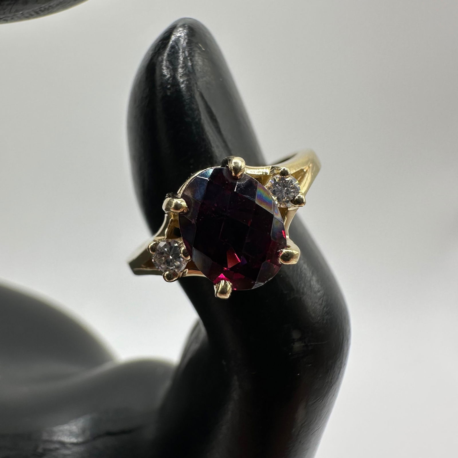 Rhodolite Garnet Two Accent Diamonds Yellow 14K Gold Ring: This item is in good pre-owned, previously used/displayed condition with noticeable light wear and surface scratches. Please reference all photos for full details. This piece of jewelry has been teste