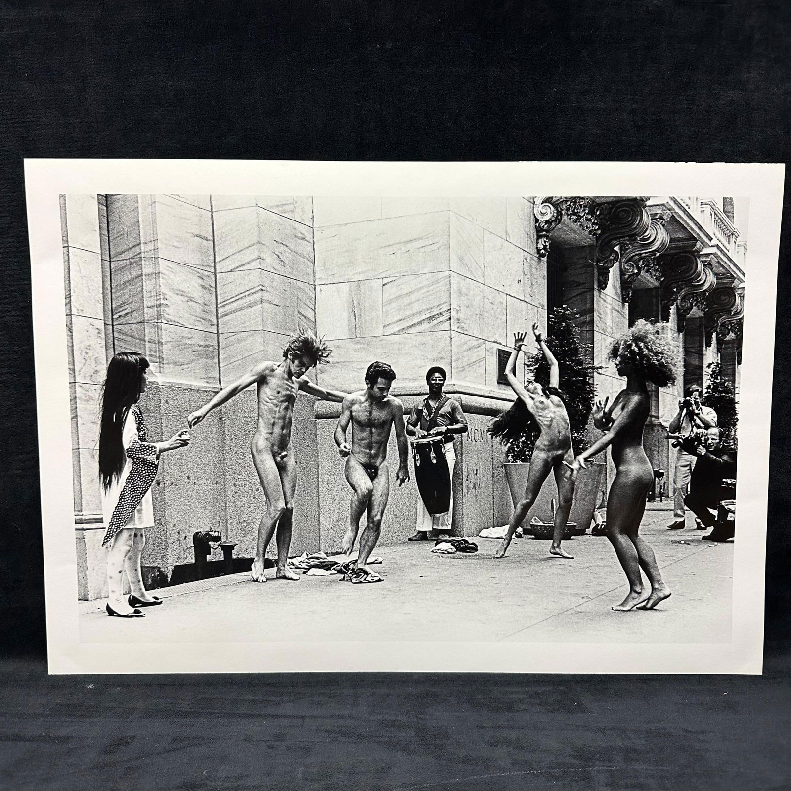 Yayoi Kusama Body Festival Black and White Large Photo Print: Large Black and white photographic print depicting Yayoi Kusama’s nude performance happening (Body Festival) outside a New York City building, circa late 1960s. The image shows dancers and onlookers
