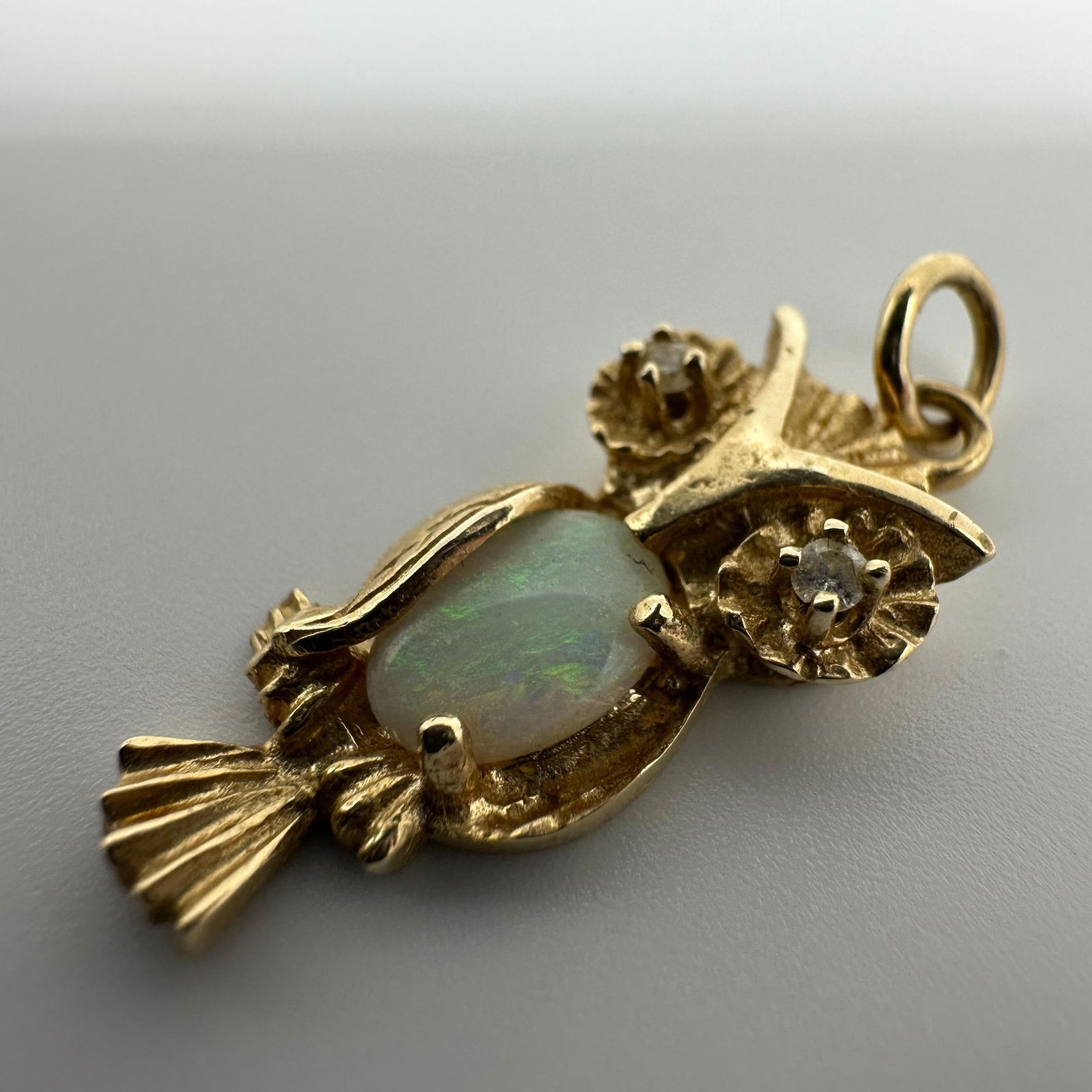 14K Gold Owl Oval Opal and Accent Diamond Pendant: This item is in good pre-owned, previously used/displayed condition with noticeable light wear and surface scratches. Please reference all photos for full details. This piece of jewelry has been teste
