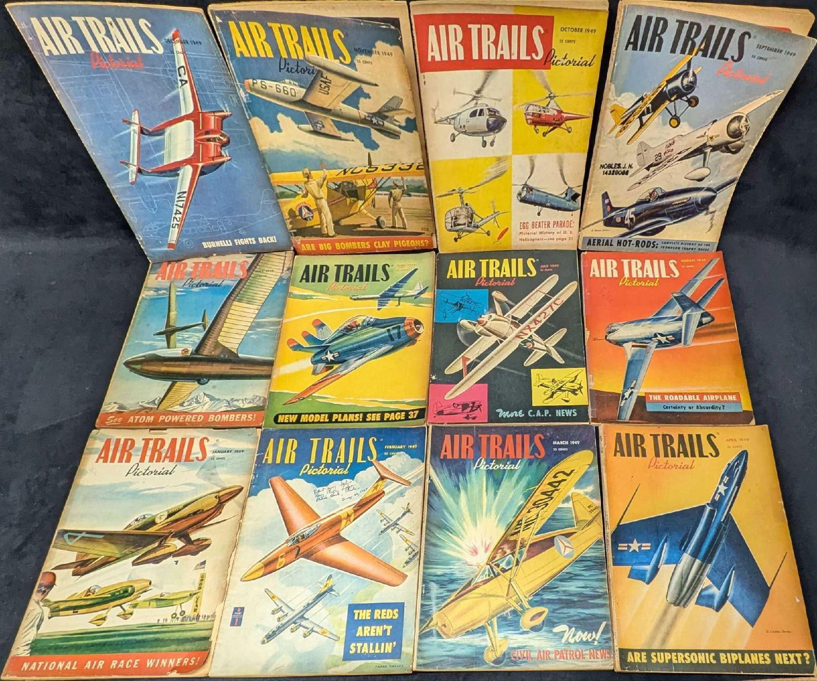 1 Full Year Of Air Trails Pictorial Magazine 1949: 1 Full Year Of Air Trails Pictorial Magazine 1949. Each magazine is approx 8 1/2" x 1/4" x 11 1/4" and the total weight is 4.90lbs. The magazines have shelf wear, and discoloration on the pages.