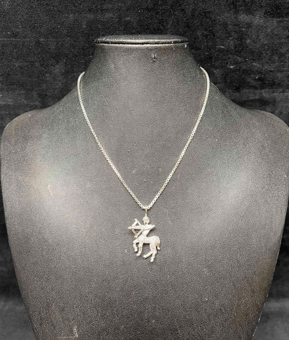Vintage Signed Silver Tone Monet Sagittarius Centaur Necklace: This lot contains a Vintage Signed Silver Tone Monet Sagittarius Centaur Necklace. It is approx 1 1/4" x 1" x 1/4". Total weight is approx 0.2oz. The vintage silver tone Monet Sagittarius necklace is