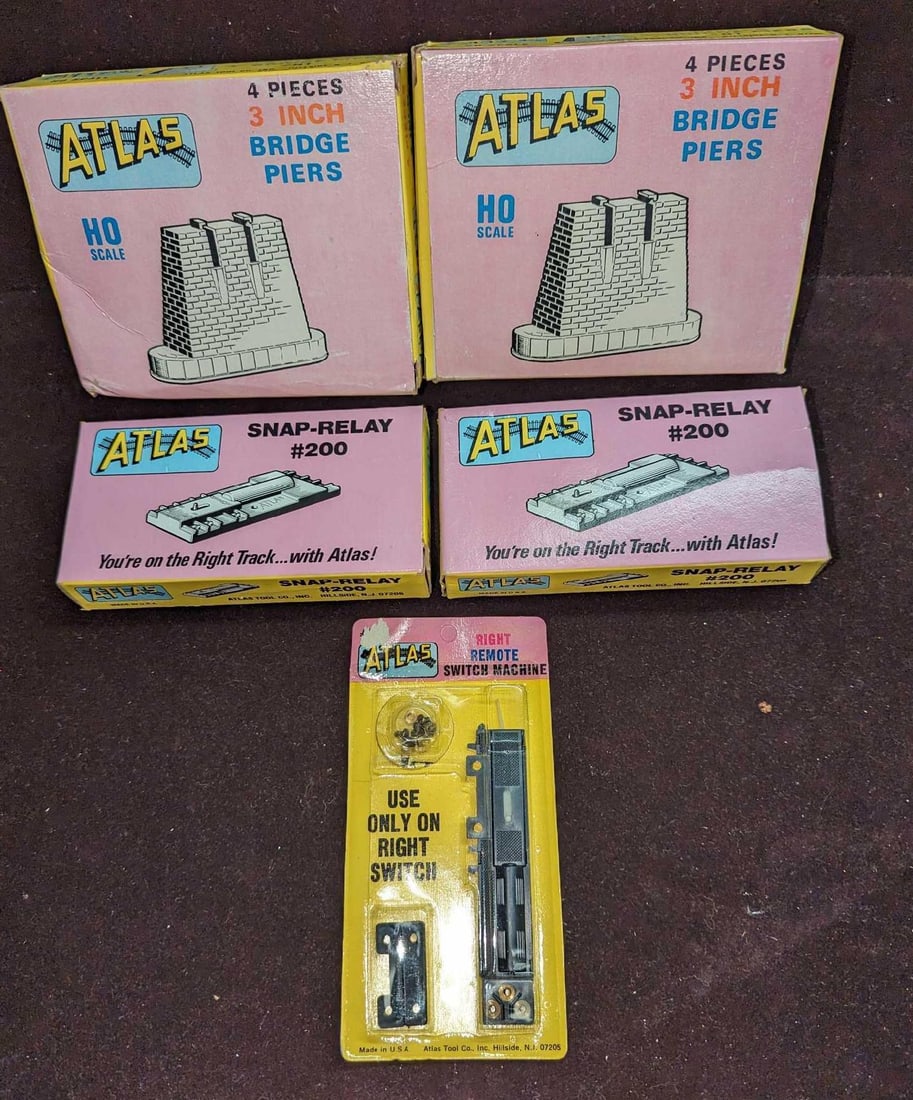 Atlas Snap-Relay Switch Machine & Bridge Piers: Atlas Snap-Relay Switch Machine & Bridge Piers. This lot includes: (2) Atlas Snap-Relay #200. Comes in its original box that is approx 5 5/8" x 1 1/4" x 2 3/4".(1) Atlas Right Remote