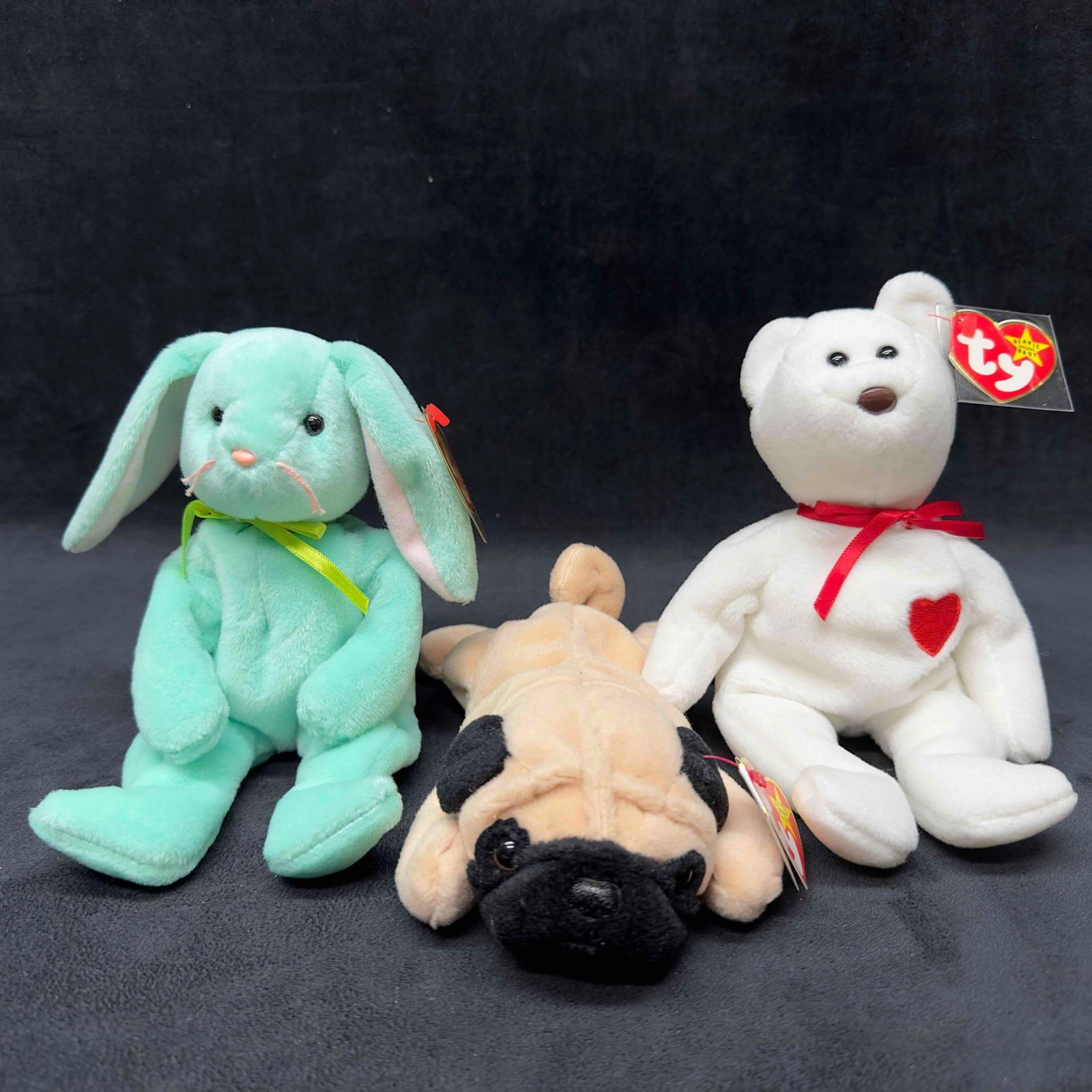 TY Beanie Baby Original Beanie Babies Collection Lot Set of Three 3 Pugsly Valentino Hippity: TY Beanie Baby Original Beanie Babies Collection Lot Set of Three 3 Pugsly Valentino Hippity. This collection includes three Beanie Babies with original tags still intact. This item is in good pre-own