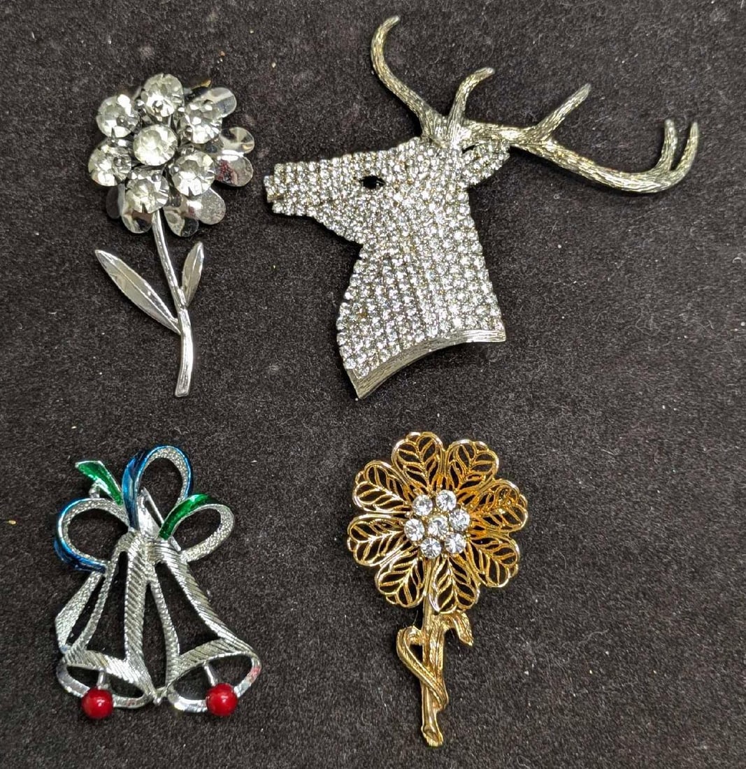 Vintage Deer Stag Flower Bells Rhinestone Brooch Pins Lot Of 4: Vintage Deer Stag Flower Bells Rhinestone Brooch Pins Lot Of 4. This lot contains: (1) Unmarked Clear Rhinestone Silver Tone Flower Brooch. This is approx 2 3/4" x 1 1/2" x1/2". (1) Unmar