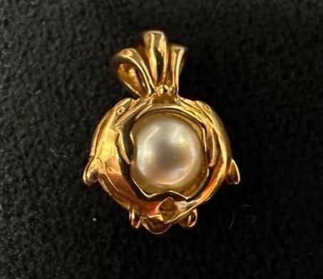 14k Gold Dolphin Pearl Locket: This piece of jewelry has been tested and researched prior to listing. Please view all our pictures they are part of our description. DETAILS: Metal - 14k GoldColor - Yellow GoldStones -
