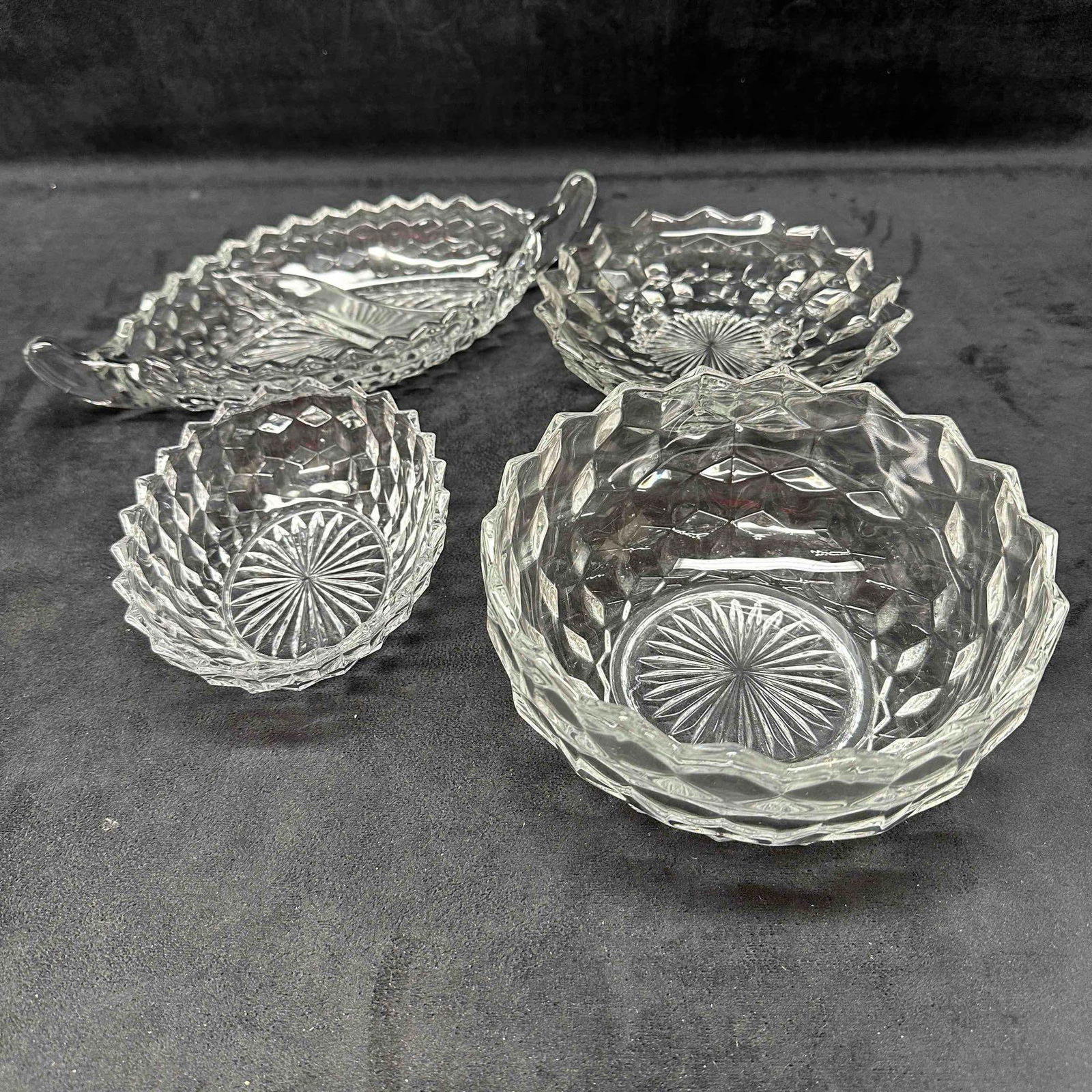 Fostoria American Crystal Glass Cubist Pattern Bowl and Dish Set of Four Glassware: This set showcases a cubist etched pattern including a small serving bowl, footed plate, small dish, and a divided relish dish. A few noticeable scratches. No chips, cracks, or breaks in the glass. Th