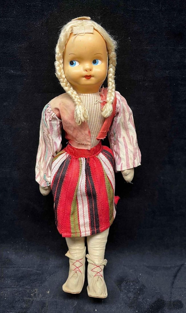 Vintage Ethnic Folk Doll Poland On Stand: This lot contains a Vintage Ethnic Folk Doll Poland On Stand. The doll has a cotton body and clothes and jointed legs. It is approx 4 3/4" x 4 3/4" x 13". Total weight is 0.7lbs. The maker of the doll